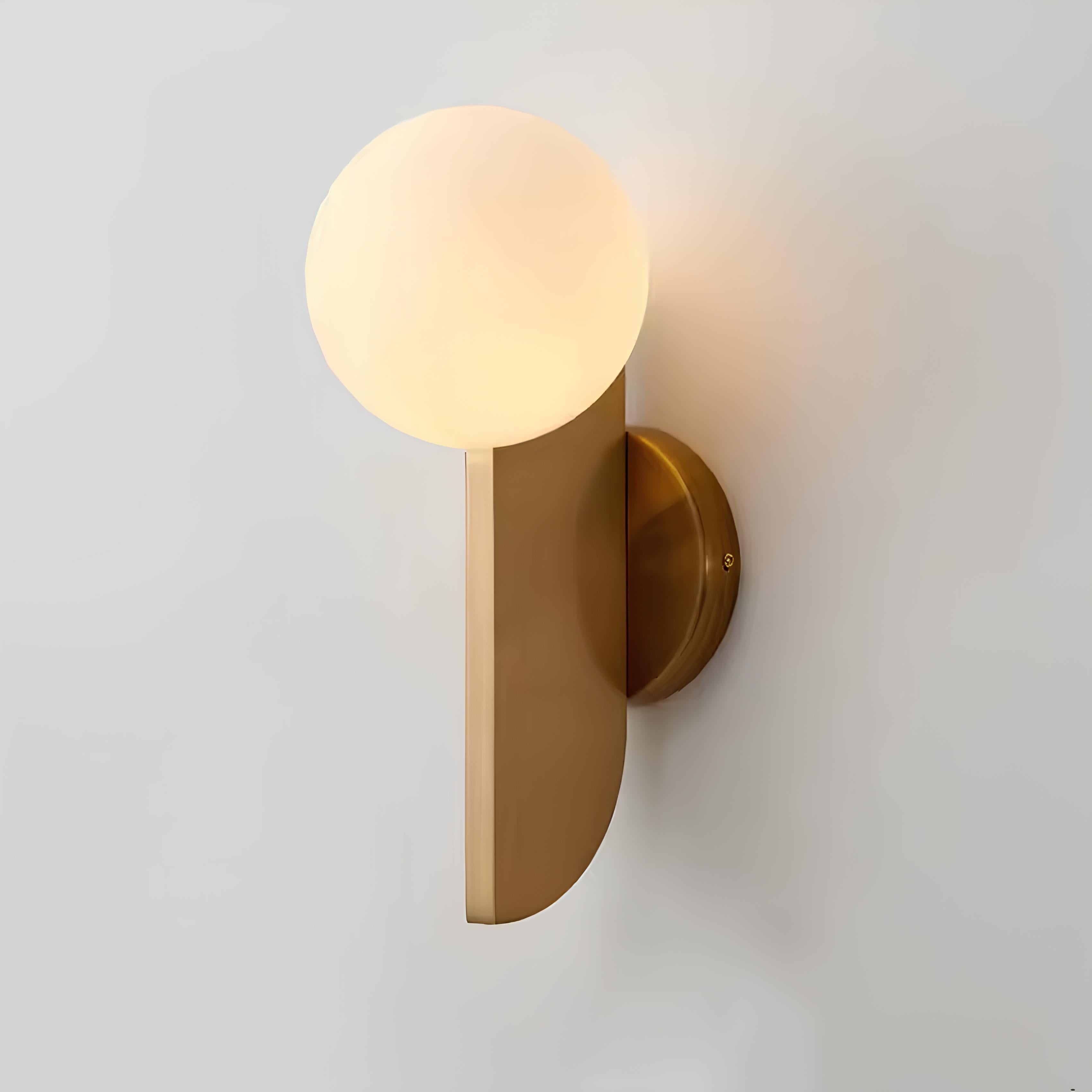 Minimalist brass finish wall light