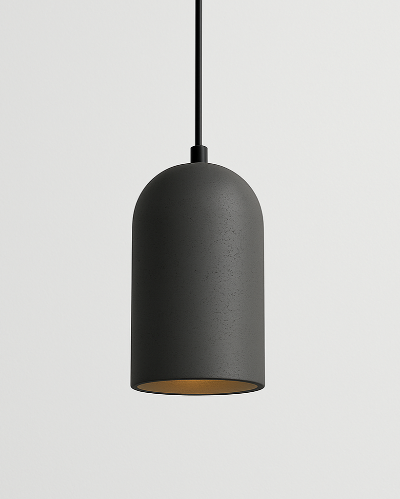 Gray cement pendant light hanging over modern bedside table