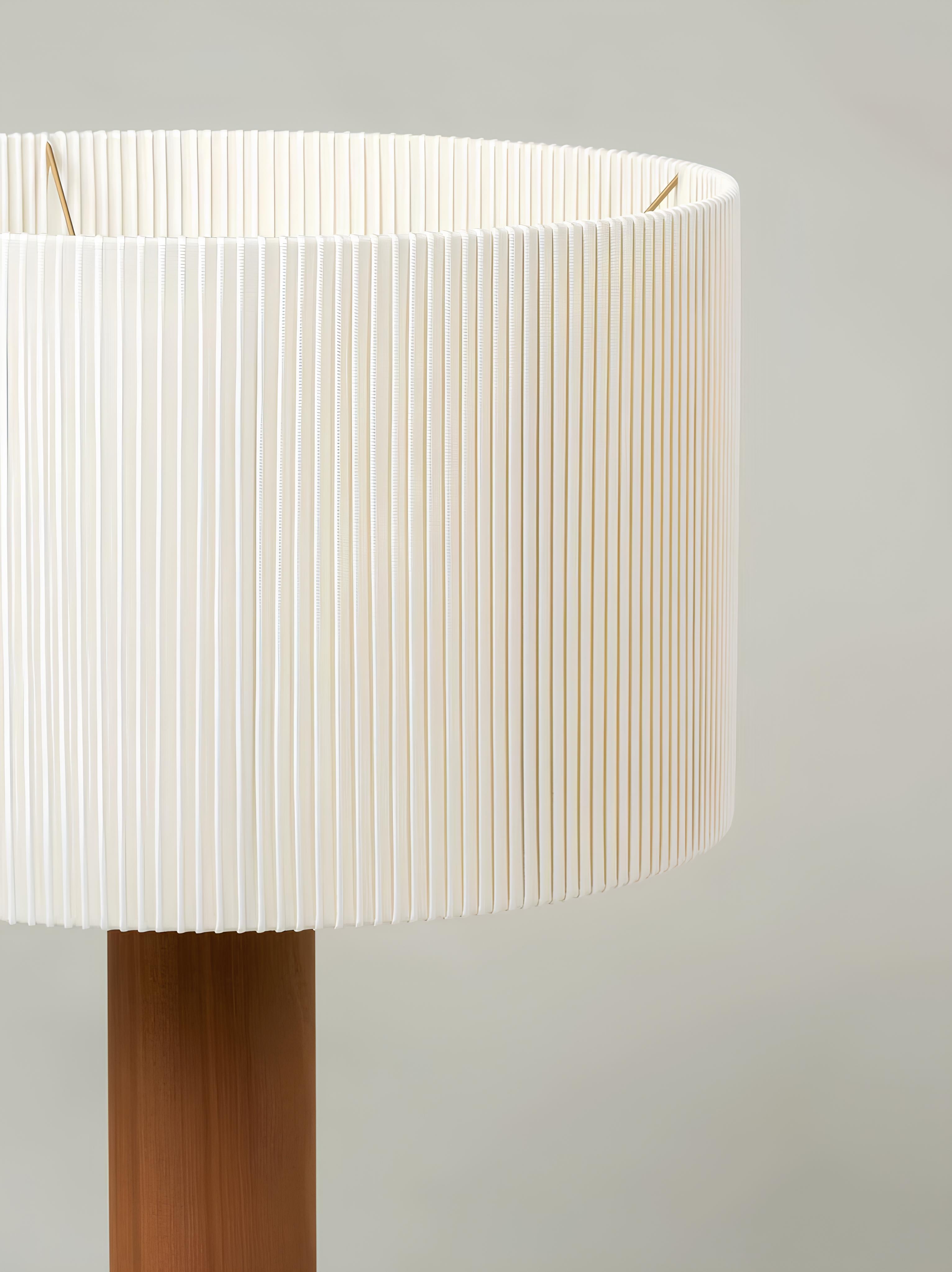 Close-up of vintage-inspired fabric shade and wood base