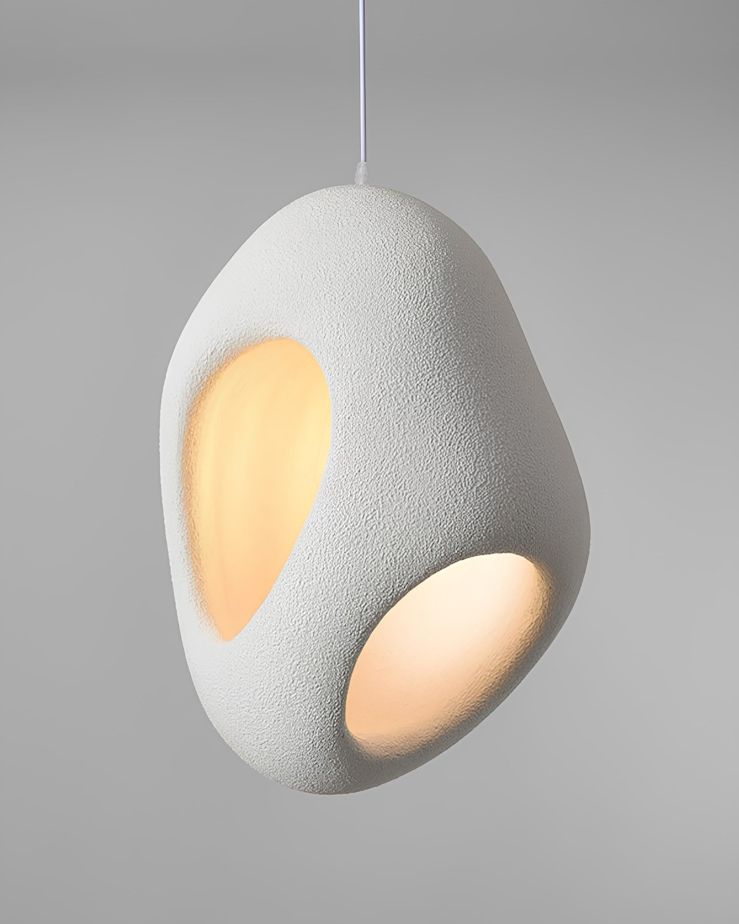 White sculptural pendant light inspired by Japanese wabi sabi design