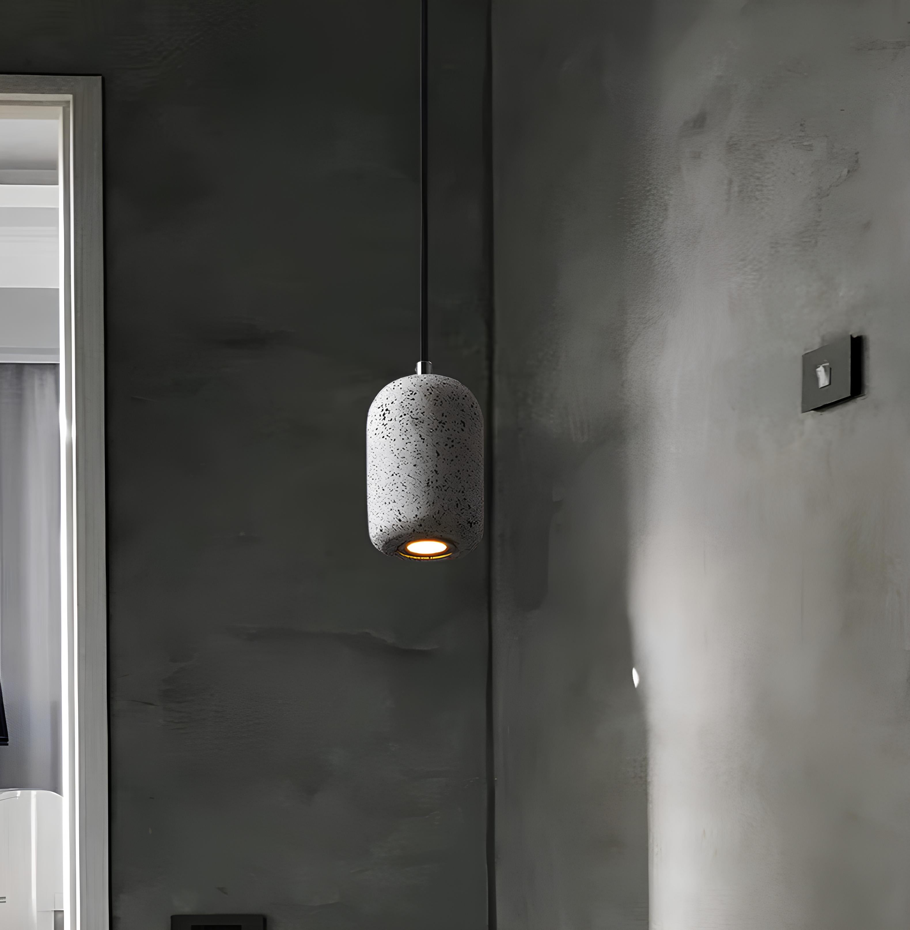 Koro cement pendant light in grey hanging in modern hallway