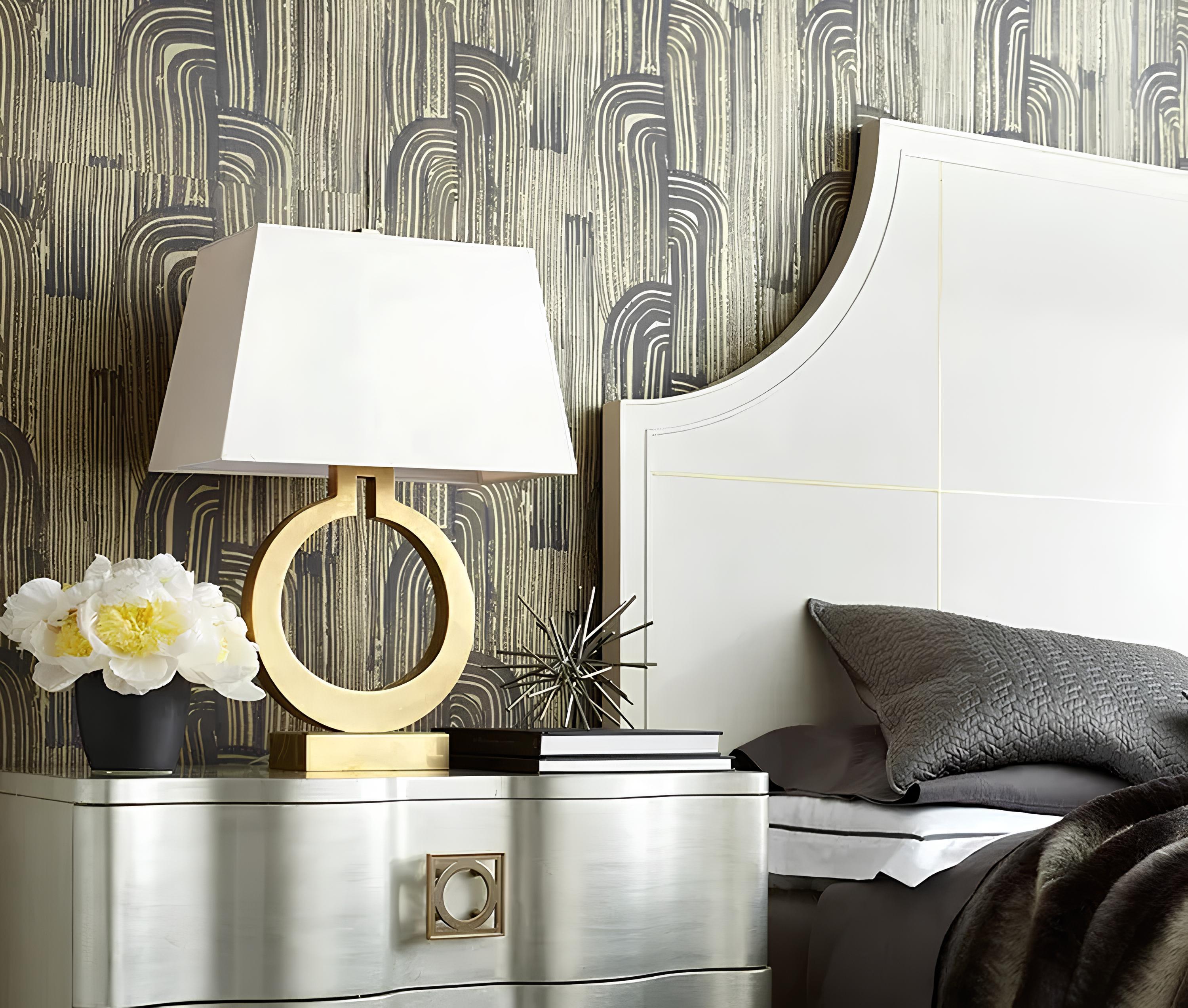 Elegant table lamp on bedside table in minimal bedroom