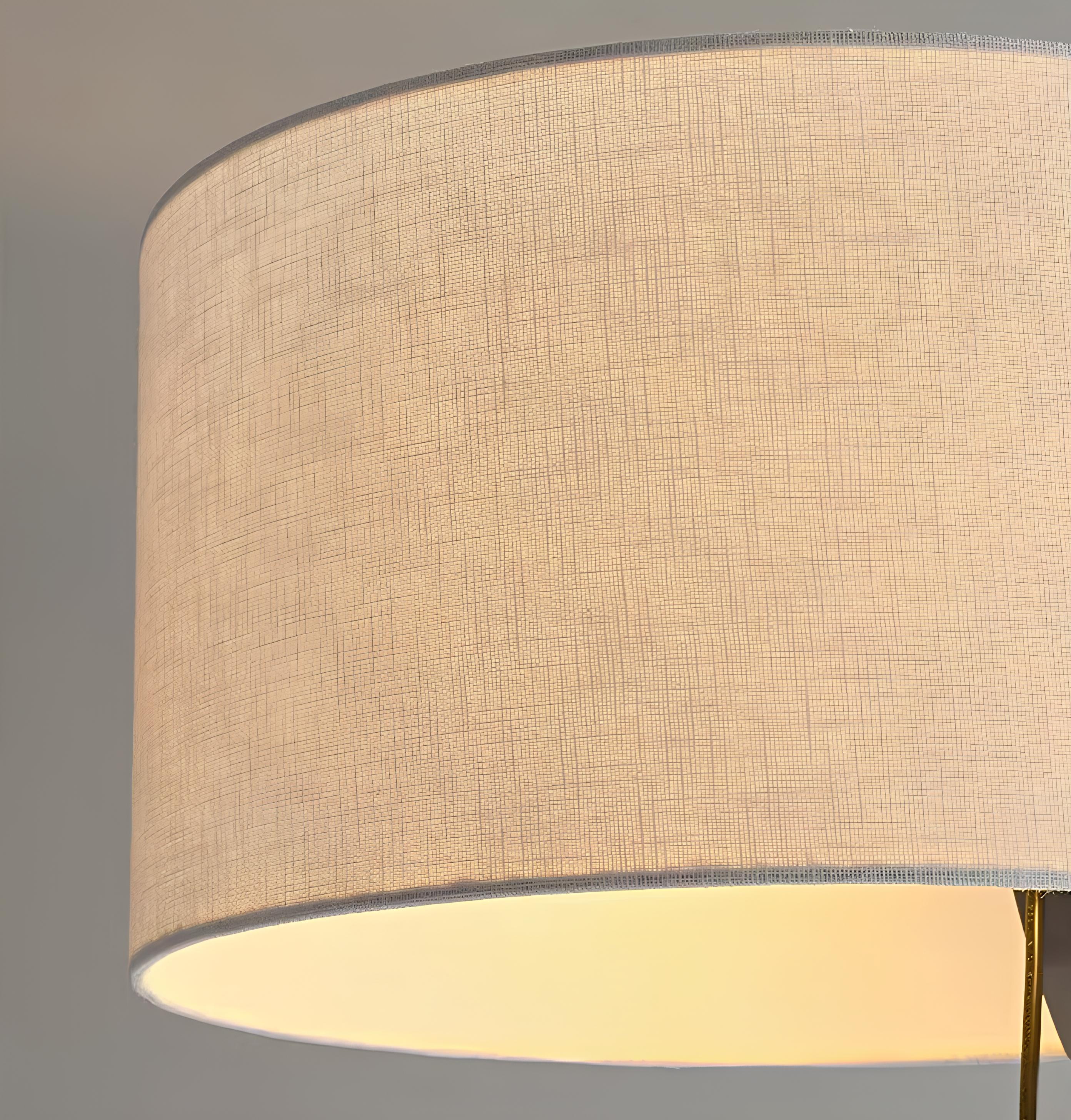 Walnut standing lamp casting soft glow in bedroom corner