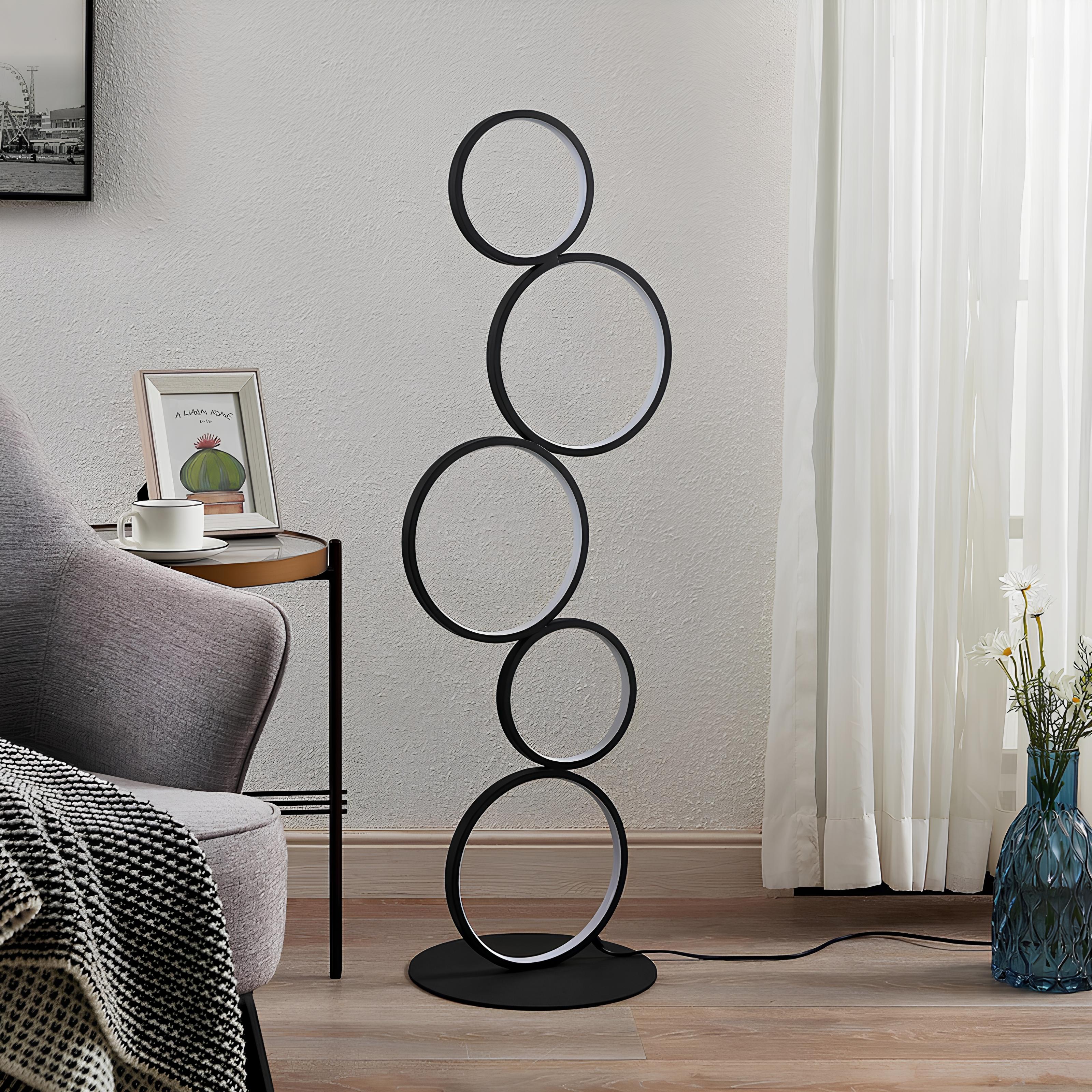 Minimalist LED standing lamp shaped like a circular halo