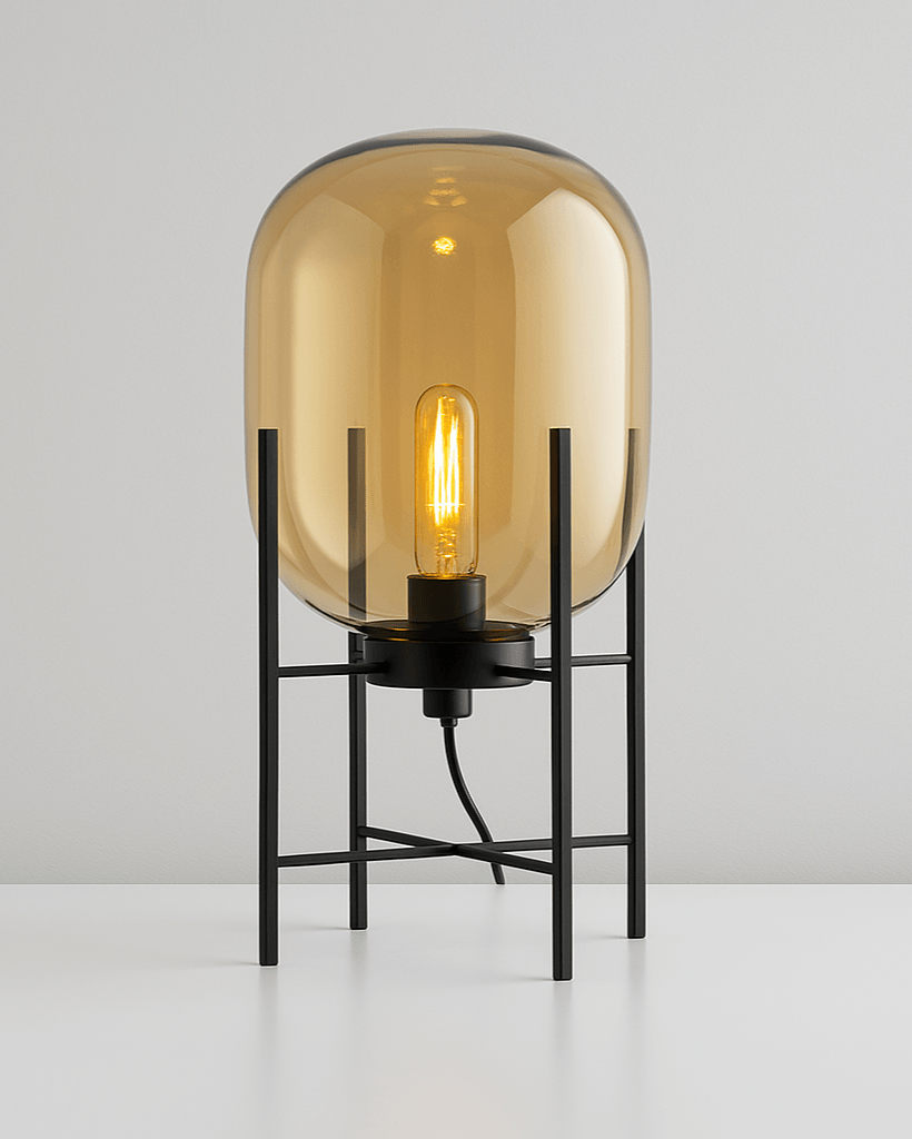 Close-up of warm glass shade and tripod base on table lamp