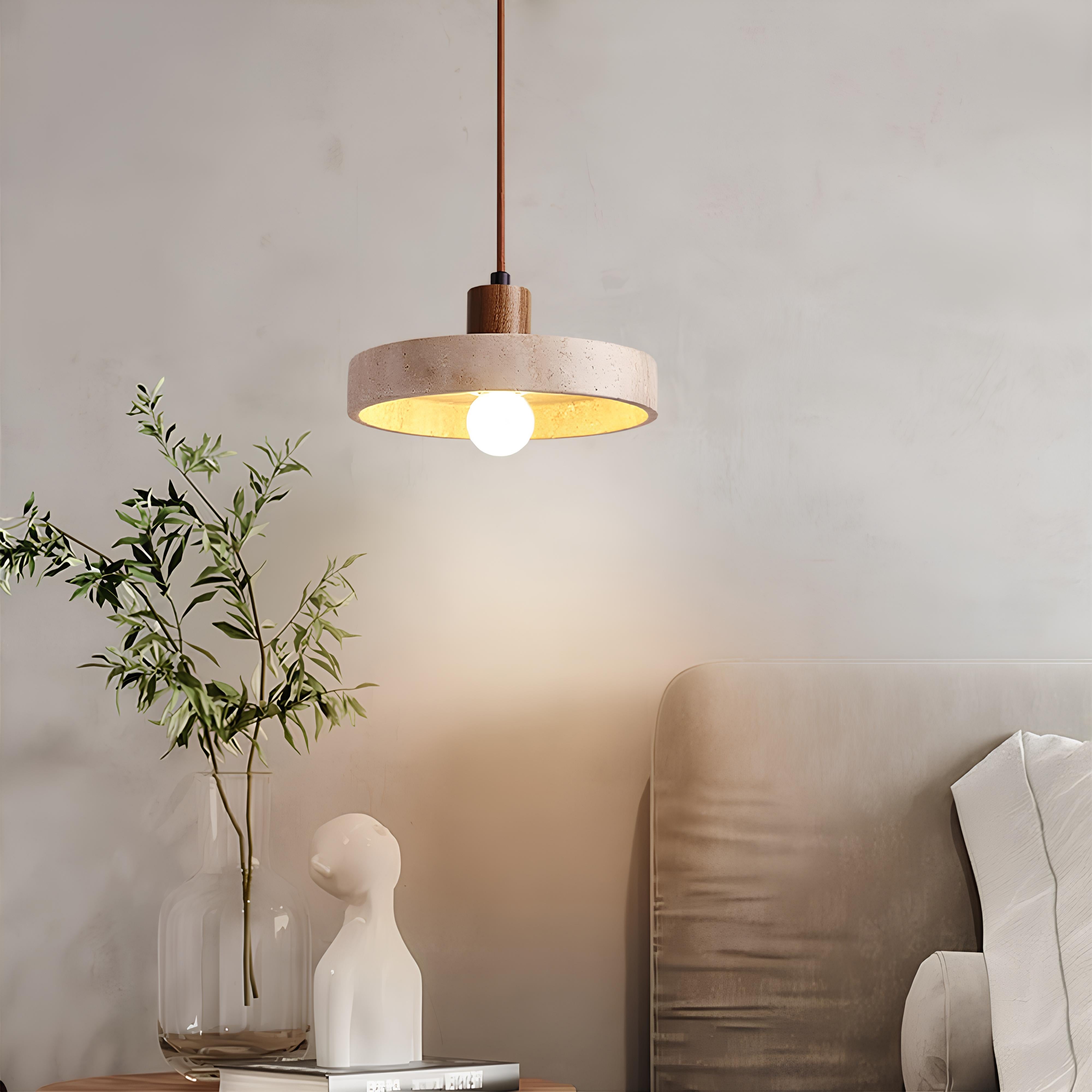 Minimalist pendant light hanging in cozy dining area
