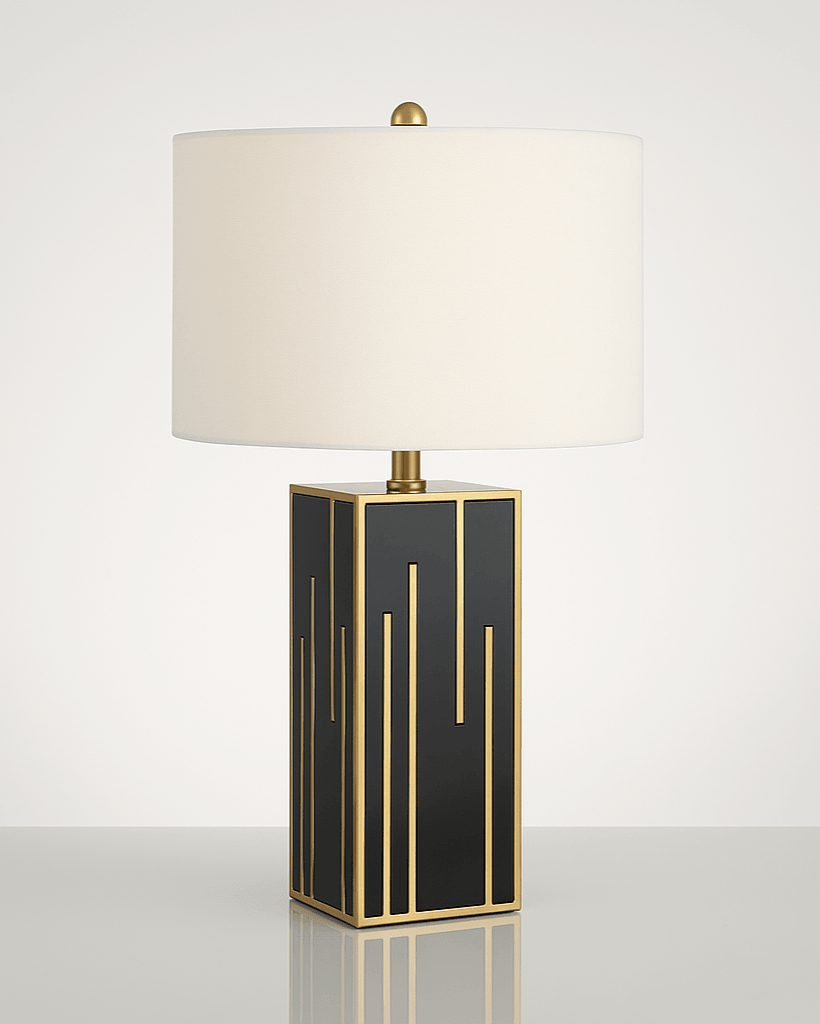 Sculptural fabric and gold lamp on bedside table in a Nordic-inspired room