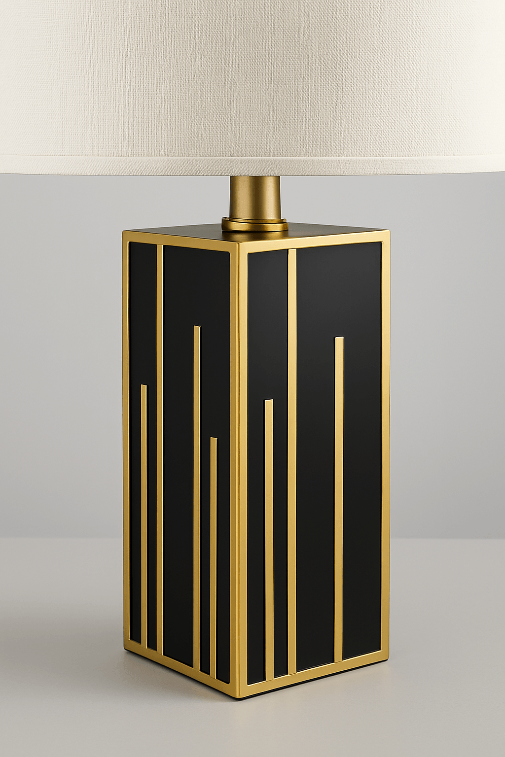 Close-up of neutral fabric shade and gold iron base