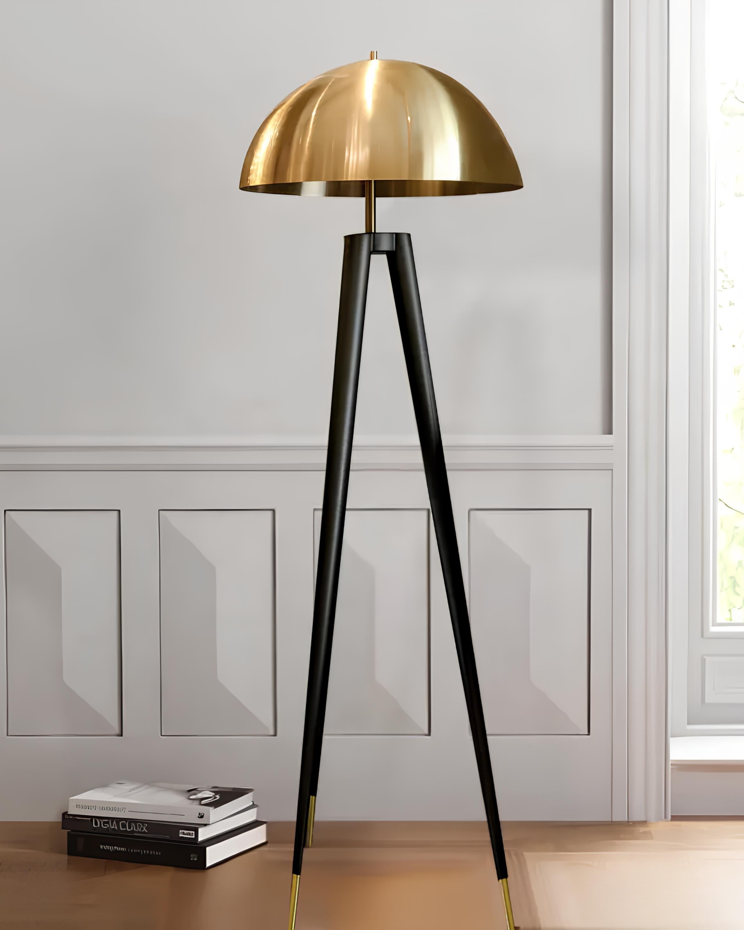 Modern gold tripod floor lamp with rounded metal shade