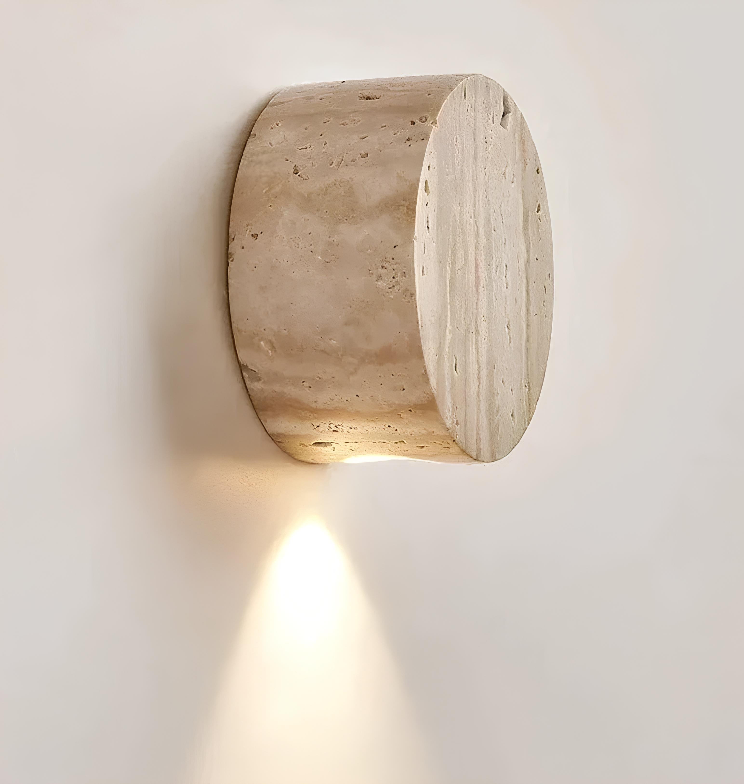 Compact stone LED wall sconce with warm glow