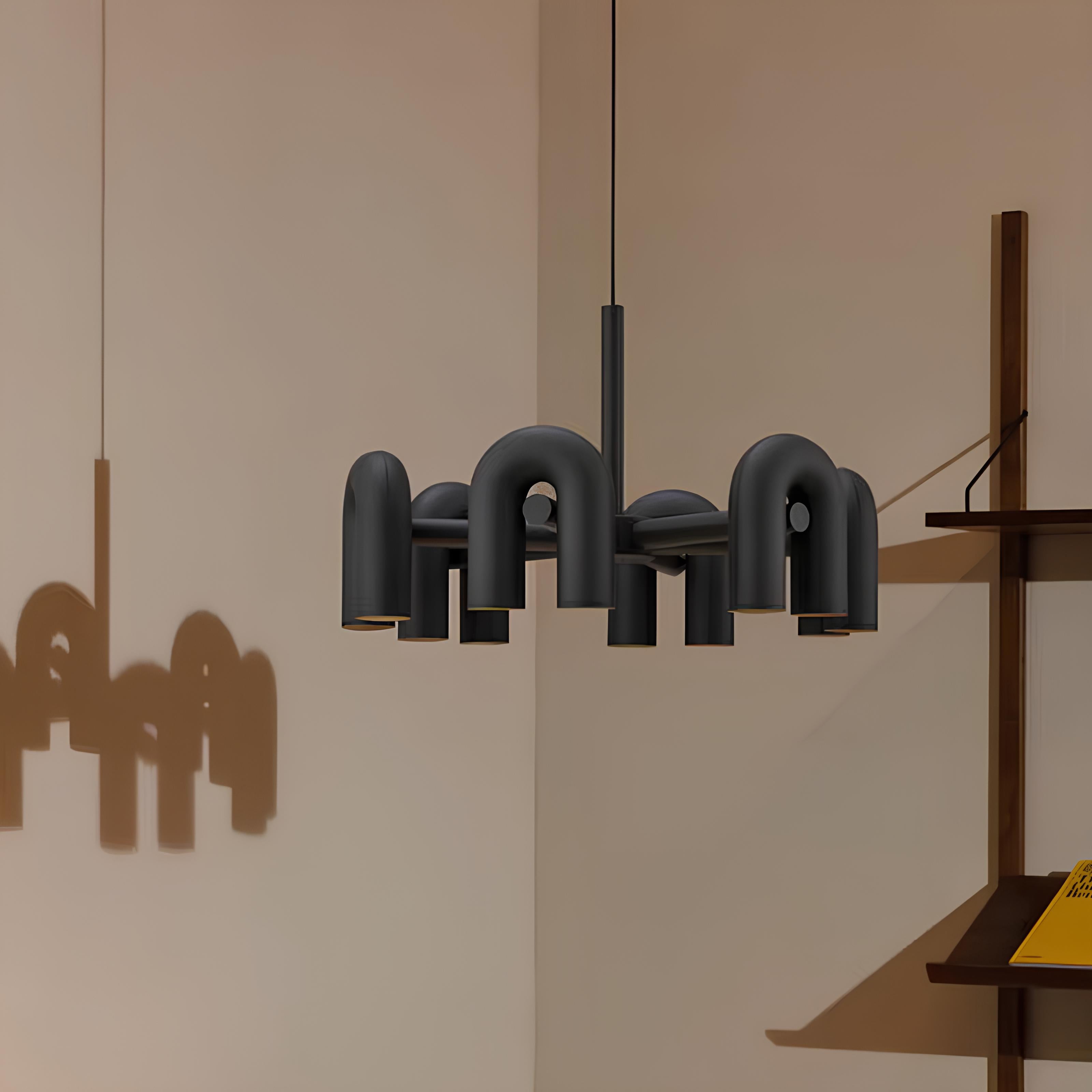 12-light black iron chandelier in gallery-style room